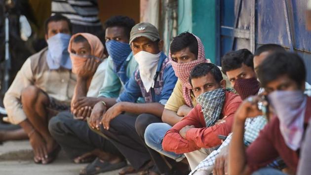 Stranded migrant workers wait for packaged food, distributed by Central Reserve Police Force (CRPF), during the nationwide lockdown in the wake of coronavirus pandemic, in Chennai. (PTI) Stranded migrant workers wait for packaged food, distributed by Central Reserve Police Force (CRPF), during the nationwide lockdown in the wake of coronavirus pandemic, in Chennai. (PTI)
