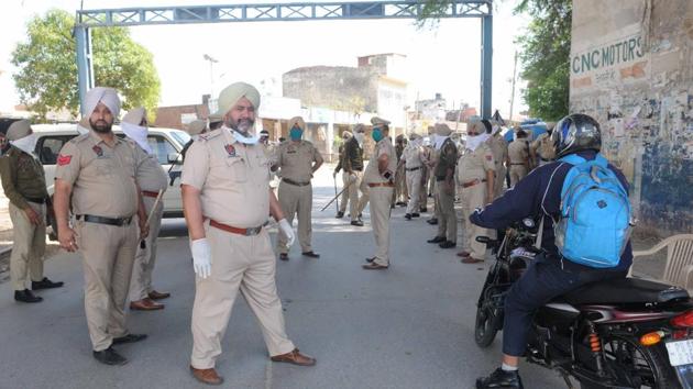 Punjab Police keeping vigil after sealing Jagatpura village in Mohali, where a Covid-19 positive case was reported on Wednesday. Punjab Police keeping vigil after sealing Jagatpura village in Mohali, where a Covid-19 positive case was reported on Wednesday.