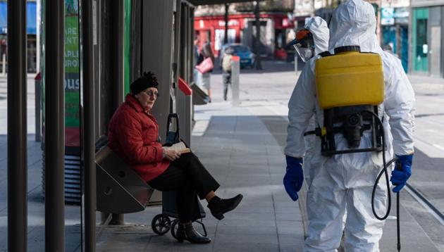 A man wearing protective gear sprays disinfectant at a tram station in central Strasbourg on April 1, 2020, on the sixteenth day of a lockdown aimed at curbing the spread of the COVID-19 (novel coronavirus). (AFP photo) A man wearing protective gear sprays disinfectant at a tram station in central Strasbourg on April 1, 2020, on the sixteenth day of a lockdown aimed at curbing the spread of the COVID-19 (novel coronavirus). (AFP photo)