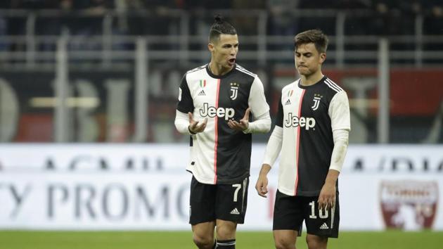 Juventus' Cristiano Ronaldo, left, speaks with Juventus' Paulo Dybala at the end of the Italian Cup soccer match between AC Milan and Juventus at the San Siro stadium, in Milan, Italy, Thursday, Feb. 13, 2020. (AP Photo/Luca Bruno) (AP) Juventus' Cristiano Ronaldo, left, speaks with Juventus' Paulo Dybala at the end of the Italian Cup soccer match between AC Milan and Juventus at the San Siro stadium, in Milan, Italy, Thursday, Feb. 13, 2020. (AP Photo/Luca Bruno) (AP)