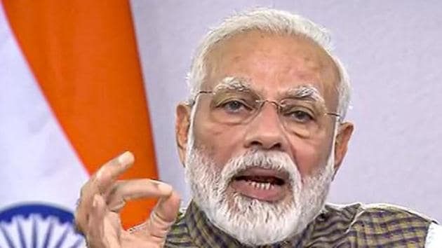 Prime Minister Narendra Modi gestures as he addresses the nation on coronavirus pandemic.(PTI)