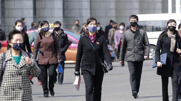 Pedestrians wear face masks to help prevent the spread of the coronavirus on Wednesday, April 1, 2020, in Pyongyang, North Korea. (AP) Pedestrians wear face masks to help prevent the spread of the coronavirus on Wednesday, April 1, 2020, in Pyongyang, North Korea. (AP)