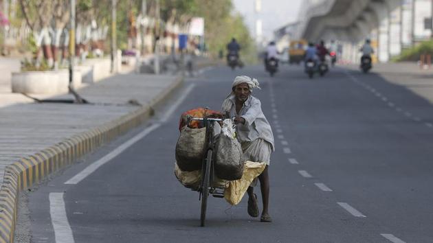 A man carries vegetables on a bicycle in Hyderabad.(AP) A man carries vegetables on a bicycle in Hyderabad.(AP)