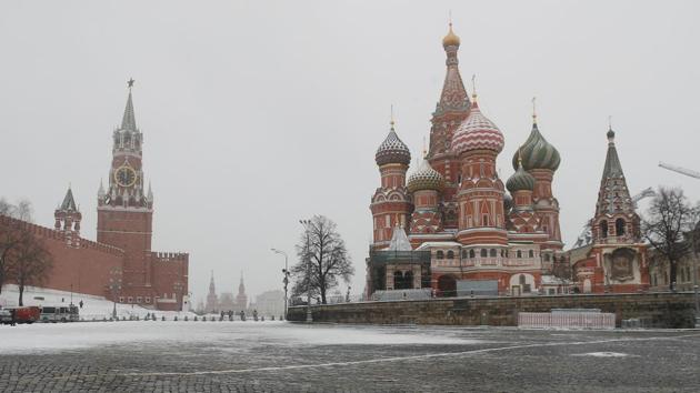 The clock on Spasskaya tower (L) showing the time at noon, is pictured next to Moscow’s Kremlin and St. Basil’s Cathedral as they stand on an empty square in Moscow, Russia. (Maxim Shemetov / REUTERS) The clock on Spasskaya tower (L) showing the time at noon, is pictured next to Moscow’s Kremlin and St. Basil’s Cathedral as they stand on an empty square in Moscow, Russia. (Maxim Shemetov / REUTERS)