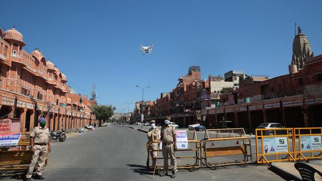 Police officials operate a drone camera to keep a tab on people's movement in Ramganj, Jaipur. (Himanshu Vyas / HT) Police officials operate a drone camera to keep a tab on people's movement in Ramganj, Jaipur. (Himanshu Vyas / HT)