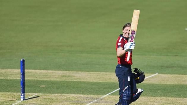 Heather Knight of England raises her bat.(AP)