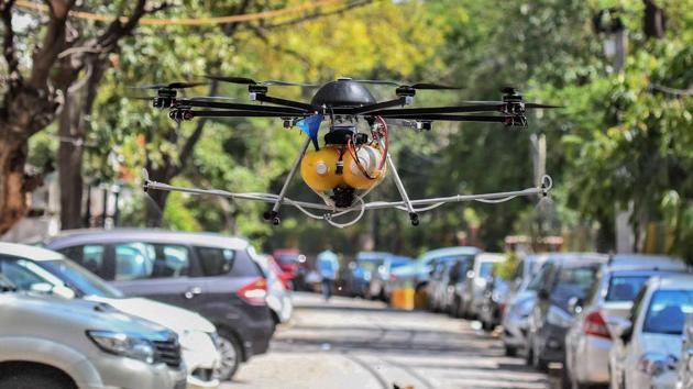 Drones being used by municipal employees to spray disinfectant during a sanitisation drive at Nizamuddin West in New Delhi. (Biplov Bhuyan/HT PHOTO) Drones being used by municipal employees to spray disinfectant during a sanitisation drive at Nizamuddin West in New Delhi. (Biplov Bhuyan/HT PHOTO)