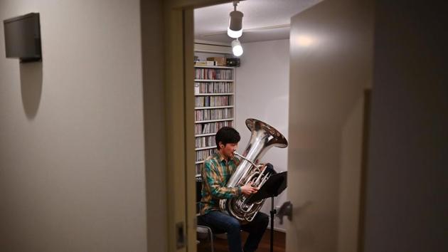 Sato confined himself in a soundproof room and filmed on a smartphone his tuba part -- mostly a rhythmical low-pitched “da-da-da”. Second violinist Sohei Birmann, 35, was more bullish about the teleworking trial initially. “We have played together for years and years to create music, so I thought we could do it with no problem,” Birmann told AFP with a smile. (Charly Triballeau / AFP) Sato confined himself in a soundproof room and filmed on a smartphone his tuba part -- mostly a rhythmical low-pitched “da-da-da”. Second violinist Sohei Birmann, 35, was more bullish about the teleworking trial initially. “We have played together for years and years to create music, so I thought we could do it with no problem,” Birmann told AFP with a smile. (Charly Triballeau / AFP)