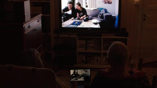 Nora Savosnick's sister Hedda Savosnick and a friend, play a board game with Nora and her parents via Zoom, in the basement of their family home. “It’s in everybody’s interest that things are going fine all over the place, because it might affect us,” Chava mused. (Nora Savosnick / REUTERS) Nora Savosnick's sister Hedda Savosnick and a friend, play a board game with Nora and her parents via Zoom, in the basement of their family home. “It’s in everybody’s interest that things are going fine all over the place, because it might affect us,” Chava mused. (Nora Savosnick / REUTERS)