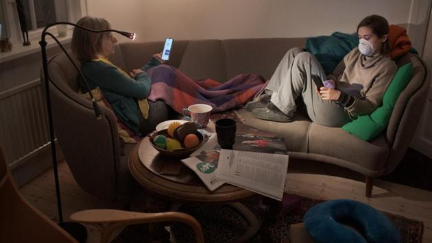 Nora Savosnick and her mother, Chava Savosnick, look at their phones while sitting in their living room, as Nora completes 14-days of quarantine, in Oslo, Norway on March 30, 2020. “The best part is that I’m getting a lot closer to you guys ... and I think a lot of people will come out of this knowing the people they lived in the house with better. And I’m very grateful for that” said Nora. (Nora Savosnick / REUTERS) Nora Savosnick and her mother, Chava Savosnick, look at their phones while sitting in their living room, as Nora completes 14-days of quarantine, in Oslo, Norway on March 30, 2020. “The best part is that I’m getting a lot closer to you guys ... and I think a lot of people will come out of this knowing the people they lived in the house with better. And I’m very grateful for that” said Nora. (Nora Savosnick / REUTERS)