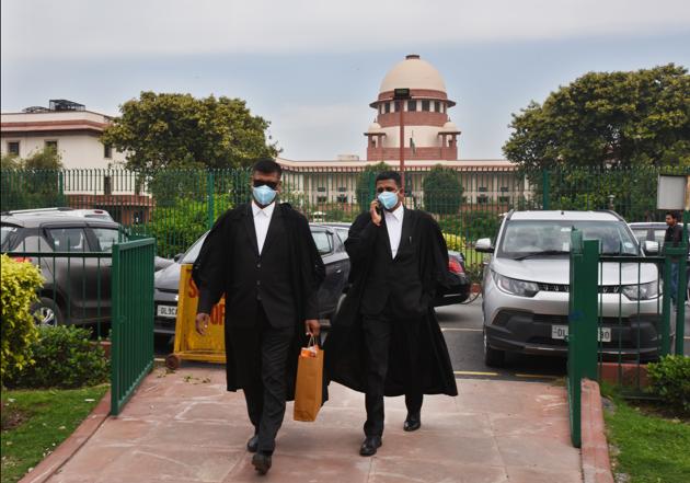 Advocates wearing protective masks as a precautionary measure amid rising coronavirus scare, at Supreme Court area, Bhagwan Dass road, in New Delhi. (Raj K Raj/HT PHOTO) Advocates wearing protective masks as a precautionary measure amid rising coronavirus scare, at Supreme Court area, Bhagwan Dass road, in New Delhi. (Raj K Raj/HT PHOTO)