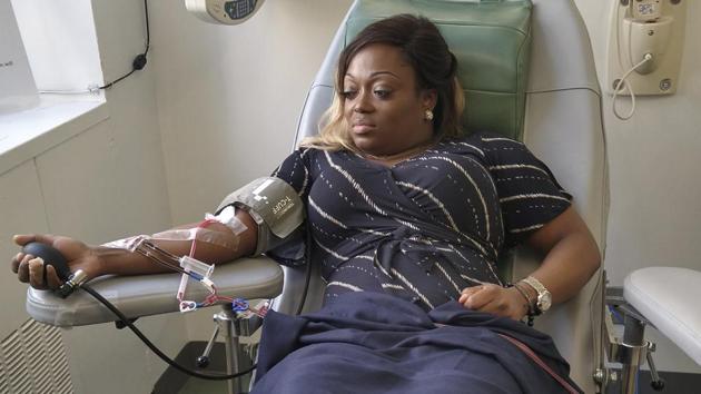 Tiffany Pinckney donates blood for a study at a hospital in New York after recovering from Covid-19. (AP) Tiffany Pinckney donates blood for a study at a hospital in New York after recovering from Covid-19. (AP)