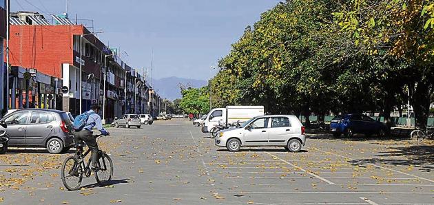 A lone cyclist riding through the deserted Sector 35 market amid the coronavirus curfew in Chandigarh. (ANIL DAYAL/HT) A lone cyclist riding through the deserted Sector 35 market amid the coronavirus curfew in Chandigarh. (ANIL DAYAL/HT)