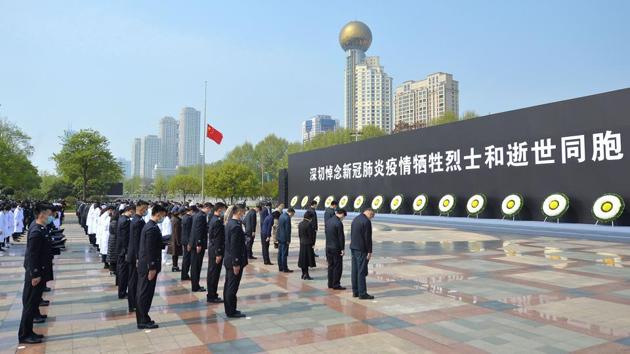 People bow during a three-minute national memorial to commemorate those who died in the COVID-19 coronavirus outbreak, in Wuhan. Officials said the observance was a chance to mourn virus “martyrs” -- an honorific title bestowed this week on 14 medical workers who died fighting the outbreak. The hashtag “China remembers its heroes” had nearly 1.3 billion views on Twitter-like Weibo Saturday. (AFP) People bow during a three-minute national memorial to commemorate those who died in the COVID-19 coronavirus outbreak, in Wuhan. Officials said the observance was a chance to mourn virus “martyrs” -- an honorific title bestowed this week on 14 medical workers who died fighting the outbreak. The hashtag “China remembers its heroes” had nearly 1.3 billion views on Twitter-like Weibo Saturday. (AFP)