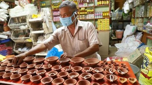 A man arranges earthen lamps during a nationwide lockdown in the wake of the coronavirus outbreak, Kozhikode, April 4, 2020(PTI)