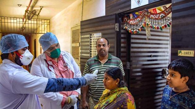 Mumbai: Medics from Rs 1 clinic conduct a door-to-door thermal screening of residents, during a nationwide lockdown, imposed in the wake of coronavirus pandemic, in Mumbai(PTI) Mumbai: Medics from Rs 1 clinic conduct a door-to-door thermal screening of residents, during a nationwide lockdown, imposed in the wake of coronavirus pandemic, in Mumbai(PTI)