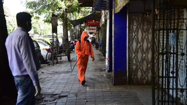 BMC civic workers sanitizes after BMC official quarantine Veer Jijamata Nagar,Worli following Covid-19 pandemic at Worli in Mumbai. (Anshuman Poyrekar/HT Photo) BMC civic workers sanitizes after BMC official quarantine Veer Jijamata Nagar,Worli following Covid-19 pandemic at Worli in Mumbai. (Anshuman Poyrekar/HT Photo)