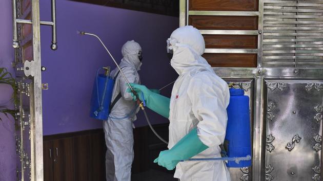 Government Public Health employees in PPE chemically disinfect the residence of a 48 year old male -- who was tested positive for Covid-19 with a travel history to UAE. (Burhaan Kinu/HT PHOTO) Government Public Health employees in PPE chemically disinfect the residence of a 48 year old male -- who was tested positive for Covid-19 with a travel history to UAE. (Burhaan Kinu/HT PHOTO)