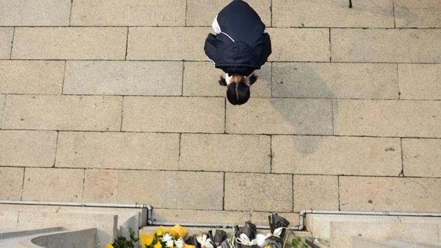A girl bows to a martyrs tower at a park in Changsha. Some restrictions were tightened again this week to prevent a second wave of infections, with authorities discouraging cemetery visits to mark the tomb sweeping festival. Cemeteries across China are offering a “cloud tomb-sweeping” service: families can honour their ancestors by watching a live stream of cemetery staff attending to graves on their behalf. (cnsphoto via REUTERS) A girl bows to a martyrs tower at a park in Changsha. Some restrictions were tightened again this week to prevent a second wave of infections, with authorities discouraging cemetery visits to mark the tomb sweeping festival. Cemeteries across China are offering a “cloud tomb-sweeping” service: families can honour their ancestors by watching a live stream of cemetery staff attending to graves on their behalf. (cnsphoto via REUTERS)