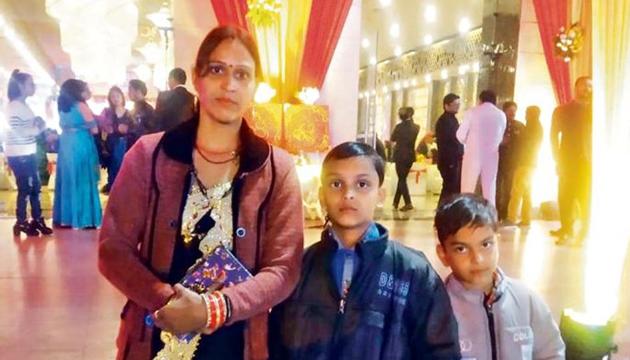 Shobha Devi’s husband is a security officer in a Gurugram apartment complex. She is seen here with her two sons. (HT Photo) Shobha Devi’s husband is a security officer in a Gurugram apartment complex. She is seen here with her two sons. (HT Photo)