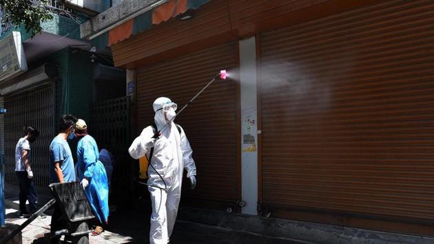 Men spray disinfectants during a sanitization effort by the Tibetan community at Majnu ka Tilla. (Mohd Zakir/ Hindustan Times) Men spray disinfectants during a sanitization effort by the Tibetan community at Majnu ka Tilla. (Mohd Zakir/ Hindustan Times)