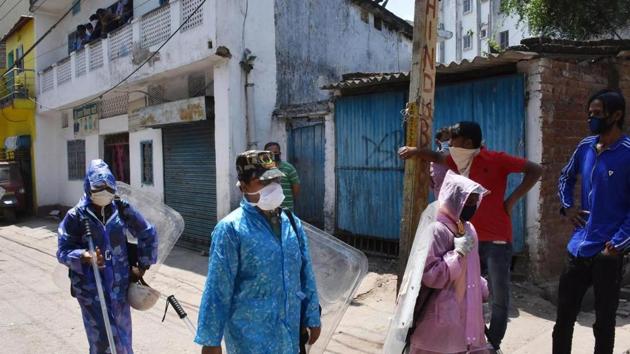 Police personnel wearing a protective outfit patrol Hindipidi area after a person tested postive for COVID-19, during a nationwide lockdown in the wake of the disease.(PTI Photo) Police personnel wearing a protective outfit patrol Hindipidi area after a person tested postive for COVID-19, during a nationwide lockdown in the wake of the disease.(PTI Photo)
