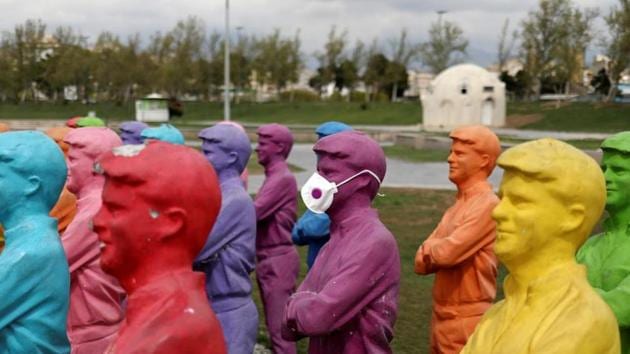 A statue wearing a protective face mask is pictured in Iran. (Reuters) A statue wearing a protective face mask is pictured in Iran. (Reuters)