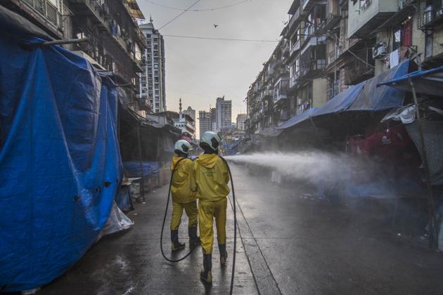 Mumbai Fire brigade officials sanitise the Null Bazar area in efforts to curb the spread of Covid-19, Sunday, April 5, 2020.(Pratik Chorge/HT Photo)