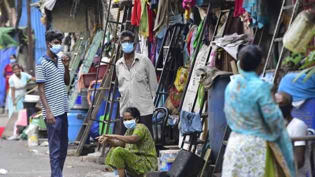 Mumbai, India - April 3, 2020: Resident of slum wearing protective mask await outside their hutment, following COVID 19 pandemic at Dharavi in Mumbai, India, on Friday, April 3, 2020. (Photo by Anshuman Poyrekar/Hindustan Times) (Anshuman Poyrekar/HT Photo) Mumbai, India - April 3, 2020: Resident of slum wearing protective mask await outside their hutment, following COVID 19 pandemic at Dharavi in Mumbai, India, on Friday, April 3, 2020. (Photo by Anshuman Poyrekar/Hindustan Times) (Anshuman Poyrekar/HT Photo)