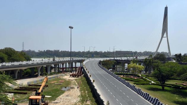 View of a deserted road near the Signature Bridge in New Delhi during the ongoing nationwide lockdown, on Monday. (ANI Photo) View of a deserted road near the Signature Bridge in New Delhi during the ongoing nationwide lockdown, on Monday. (ANI Photo)
