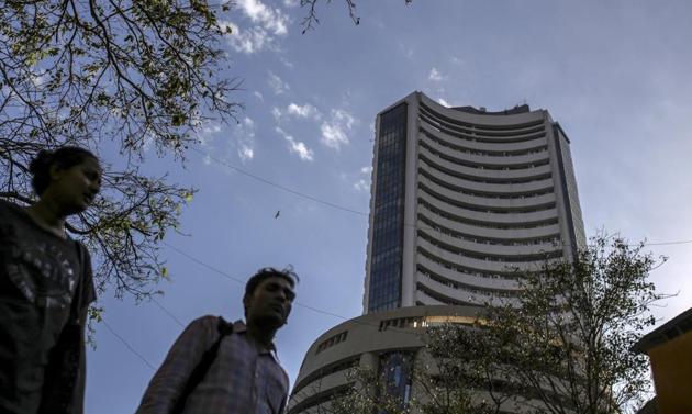 Pedestrians walks past the Bombay Stock Exchange (BSE) building in Mumbai, India, on Monday, March 9, 2020.(Bloomberg)