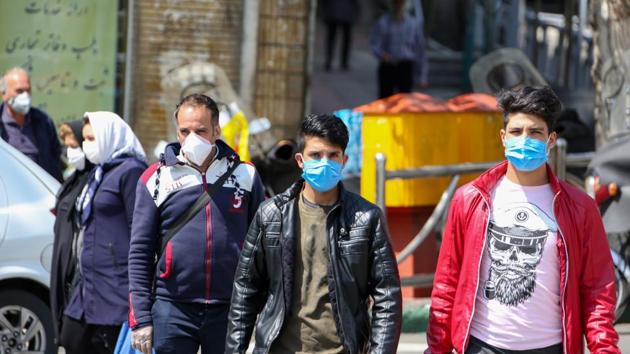 Iranians wear protective face masks to check the spread of coronavirus disease Covid-19, in capital Tehran on April 5.(AFP Photo)