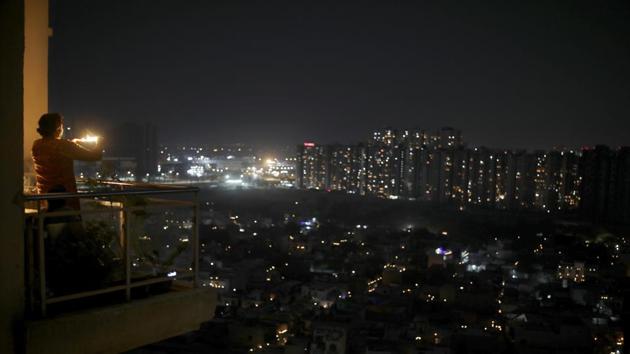 All across Noida, people came up with creative ways to mark the nine minutes. (AP) All across Noida, people came up with creative ways to mark the nine minutes. (AP)