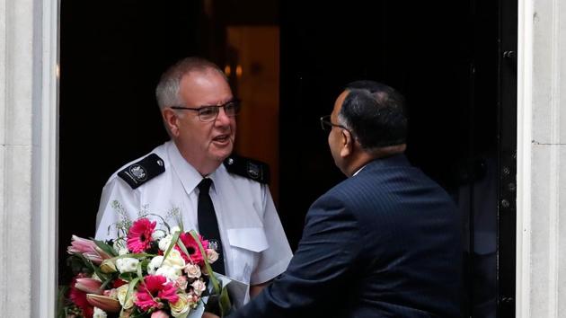 Flowers from the Pakistan embassy are delivered to 10 Downing Street in central London, on April 7, 2020 as Britain's Prime Minister Boris Johnson spent the nigh tin intensive care at St Thomas' Hospital with symptons of the novel coronavirus COVID-19.(AFP)
