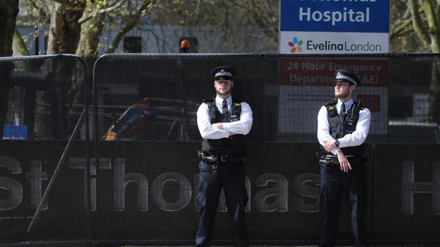 Police officers stand on duty outside St Thomas' Hospital in central London on April 7, 2020. where Britain's Prime Minister Boris Johnson is in intensive care with symptons of the novel coronavirus COVID-19. (AFP) Police officers stand on duty outside St Thomas' Hospital in central London on April 7, 2020. where Britain's Prime Minister Boris Johnson is in intensive care with symptons of the novel coronavirus COVID-19. (AFP)