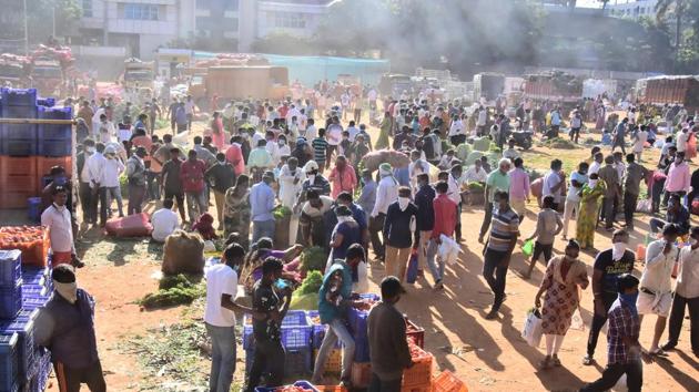 People buy vegetables from a makeshift market in National College grounds, during a nationwide lockdown, imposed in the wake of coronavirus pandemic, in Bengaluru, Saturday, March 28, 2020. (PTI/ Image for representation) People buy vegetables from a makeshift market in National College grounds, during a nationwide lockdown, imposed in the wake of coronavirus pandemic, in Bengaluru, Saturday, March 28, 2020. (PTI/ Image for representation)