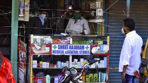 Medical shopkeepers cordon off themselves from customers with help of nylon strings for proper adherence of social distancing. Activists and health workers had expressed concerns over how social distancing is practically impossible in an area like Dharavi, where an average of 10-12 people stay in each of 57,000 housing units measuring around 250 sq ft each. (Anshuman Poyrekar / HT Photo) Medical shopkeepers cordon off themselves from customers with help of nylon strings for proper adherence of social distancing. Activists and health workers had expressed concerns over how social distancing is practically impossible in an area like Dharavi, where an average of 10-12 people stay in each of 57,000 housing units measuring around 250 sq ft each. (Anshuman Poyrekar / HT Photo)