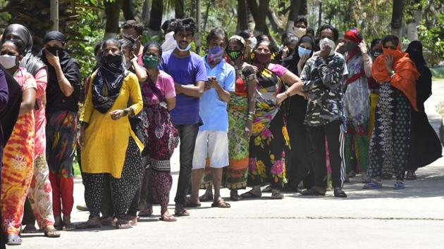 Residents stand in queue to collect ration distributed by local social workers. “Ever since the first death was reported on April 1, we have been targeted,” a local resident said. A private hospital allegedly cancelled the dialysis appointment of 47-year-old Amin Mansoori from Dharavi on Friday morning. (Anshuman Poyrekar / HT Photo) Residents stand in queue to collect ration distributed by local social workers. “Ever since the first death was reported on April 1, we have been targeted,” a local resident said. A private hospital allegedly cancelled the dialysis appointment of 47-year-old Amin Mansoori from Dharavi on Friday morning. (Anshuman Poyrekar / HT Photo)