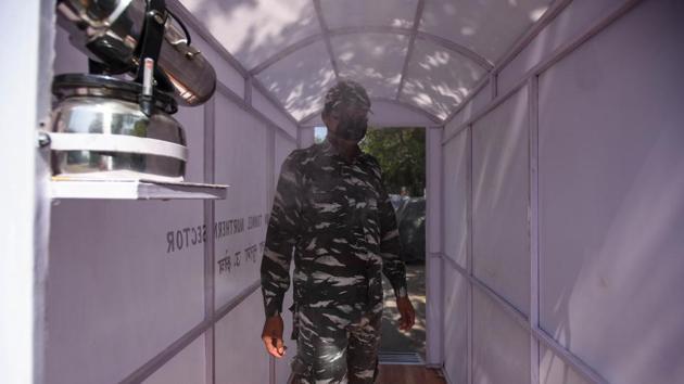 A CRPF personnel walks through a disinfection tunnel, on day thirteen of the 21 day nationwide lockdown to check the spread of coronavirus, at R K Puram in New Delhi, India, on Monday, April 6, 2020. (Amal KS/HT PHOTO/ Image for representation) A CRPF personnel walks through a disinfection tunnel, on day thirteen of the 21 day nationwide lockdown to check the spread of coronavirus, at R K Puram in New Delhi, India, on Monday, April 6, 2020. (Amal KS/HT PHOTO/ Image for representation)