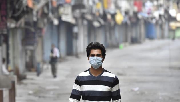 A man wearing a face mask out walking in the Sadar Bazaar market while shops remain shuttered, on day fourteen of the 21 day nationwide lockdown to check the spread of coronavirus. (Ajay Aggarwal/HT photo) A man wearing a face mask out walking in the Sadar Bazaar market while shops remain shuttered, on day fourteen of the 21 day nationwide lockdown to check the spread of coronavirus. (Ajay Aggarwal/HT photo)