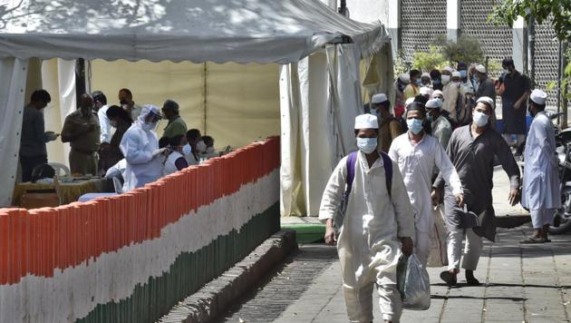 People who took part in a Tablighi Jamaat function earlier this month walking to board buses that will take them to a quarantine facility amid concerns of infection on March 31, 2020. (Ajay Aggarwal/HT PHOTO) People who took part in a Tablighi Jamaat function earlier this month walking to board buses that will take them to a quarantine facility amid concerns of infection on March 31, 2020. (Ajay Aggarwal/HT PHOTO)