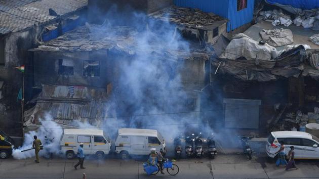 Municipal staff fumigates a portion of a Dharavi slum as a preventive measure against the spread of the coronavirus. (Indranil Mukherjee / AFP) Municipal staff fumigates a portion of a Dharavi slum as a preventive measure against the spread of the coronavirus. (Indranil Mukherjee / AFP)