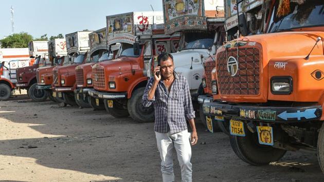 A man walks near trucks parked in a field due to ongoing COVID-19 lockdown, at Transport Nagar in Lucknow, Tuesday, April 7, 2020. (PTI) A man walks near trucks parked in a field due to ongoing COVID-19 lockdown, at Transport Nagar in Lucknow, Tuesday, April 7, 2020. (PTI)