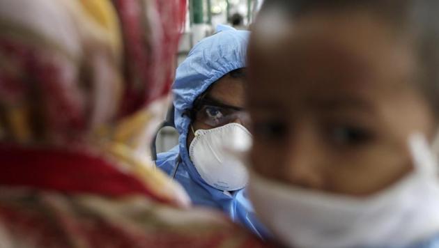 A doctor interacts with people at a slum area during lockdown to control the spread of the new coronavirus in Mumbai, India, Monday, April 6, 2020. The new coronavirus causes mild or moderate symptoms for most people, but for some, especially older adults and people with existing health problems, it can cause more severe illness or death. (AP) A doctor interacts with people at a slum area during lockdown to control the spread of the new coronavirus in Mumbai, India, Monday, April 6, 2020. The new coronavirus causes mild or moderate symptoms for most people, but for some, especially older adults and people with existing health problems, it can cause more severe illness or death. (AP)
