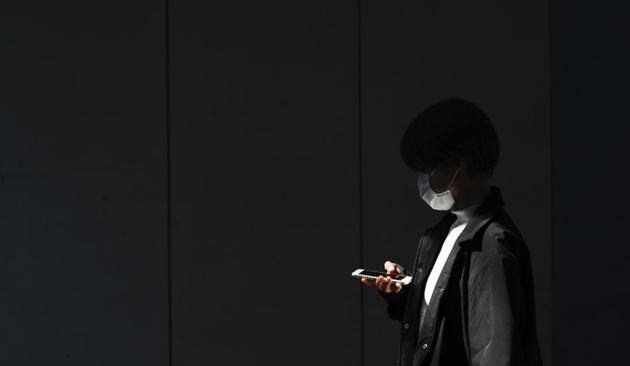 A woman with a protective face mask walks into the shade of an underpass Monday, April 6, 2020, in Tokyo. (AP) A woman with a protective face mask walks into the shade of an underpass Monday, April 6, 2020, in Tokyo. (AP)