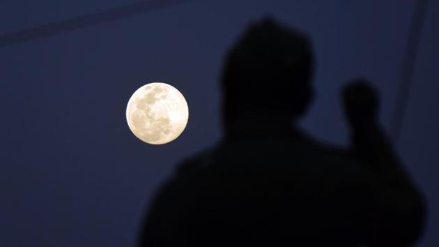 A view of the super pink moon seen from Prayagraj in Uttar Pradesh. This is also the biggest full moon of the year 2020. (ANI)