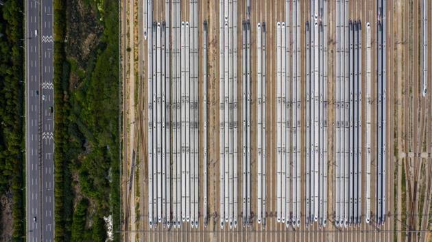 This aerial photo taken on April 7, 2020 shows bullet trains at a station in preparation for resuming operations after authorities lifted a more than two-month ban on outbound travel, in Wuhan in China's central Hubei province. (STR / AFP) This aerial photo taken on April 7, 2020 shows bullet trains at a station in preparation for resuming operations after authorities lifted a more than two-month ban on outbound travel, in Wuhan in China's central Hubei province. (STR / AFP)