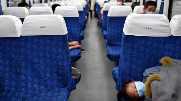 Passengers rest inside a high speed train at Wuchang Railway Station after travel restrictions to leave Wuhan, the capital of Hubei province and China's epicentre of the novel coronavirus disease (COVID-19) outbreak, were lifted, April 8, 2020. (Stringer / REUTERS) Passengers rest inside a high speed train at Wuchang Railway Station after travel restrictions to leave Wuhan, the capital of Hubei province and China's epicentre of the novel coronavirus disease (COVID-19) outbreak, were lifted, April 8, 2020. (Stringer / REUTERS)