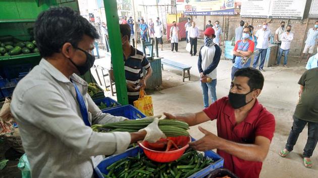 People came out of their houses in large number to buy essential commodities like groceries, vegetables, fruits, milk powder, medicines, etc in anticipation that all shops would be shut in their vicinity. (ANI Photo) People came out of their houses in large number to buy essential commodities like groceries, vegetables, fruits, milk powder, medicines, etc in anticipation that all shops would be shut in their vicinity. (ANI Photo)