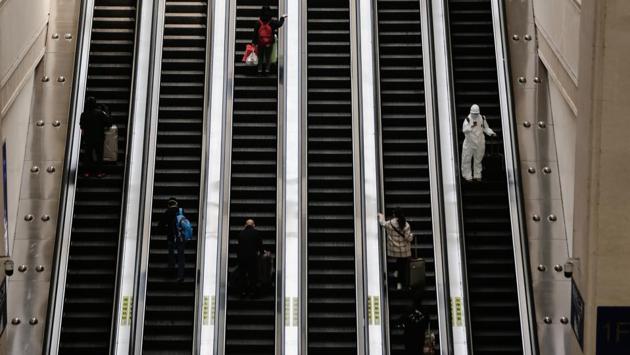 Commuters on escalators inside the Hankou railway station in Wuhan, Hubei Province, China, on Wednesday, April 8, 2020. Official news agency, Xinhua, reported that more than 55,000 passengers are expected to leave Wuhan by train on Wednesday, and about 40% of them are going to the Pearl River Delta Region in southern China. (Bloomberg) Commuters on escalators inside the Hankou railway station in Wuhan, Hubei Province, China, on Wednesday, April 8, 2020. Official news agency, Xinhua, reported that more than 55,000 passengers are expected to leave Wuhan by train on Wednesday, and about 40% of them are going to the Pearl River Delta Region in southern China. (Bloomberg)